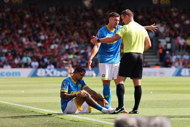 Football - 2025 2026 Premier League - AFC Bournemouth vs Wolverhampton Wanderers - The Vitality Stadium - Saturday 23rd August 2025 Referee Mr Thomas Bramall asks Ki-Jana Hoever of Wolverhampton to leave the pitch during the Premier League match at the Vitality Stadium COLORSPORT Shaun Boggust 