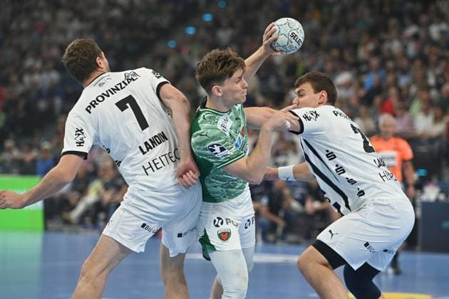 Nils LICHTLEIN Fuechse Berlin , action,duel against Magnus Landin JACOBSEN Kiel and Lukas LAUBE Kiel Handball Super Cup 2025 of the men Fuechse Berlin vs THW Kiel on 23 08 2025, SAP GARDEN Munich