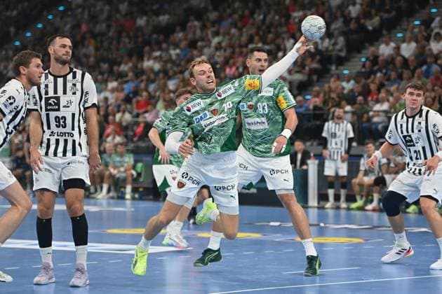 Mathias GIDSEL Fuechse Berlin , action,throw,left Veron NACINOVIC Kiel , Magnus Landin JACOBSEN Kiel Handball Super Cup 2025 of the men Fuechse Berlin vs THW Kiel on 23 08 2025, SAP GARDEN Munich