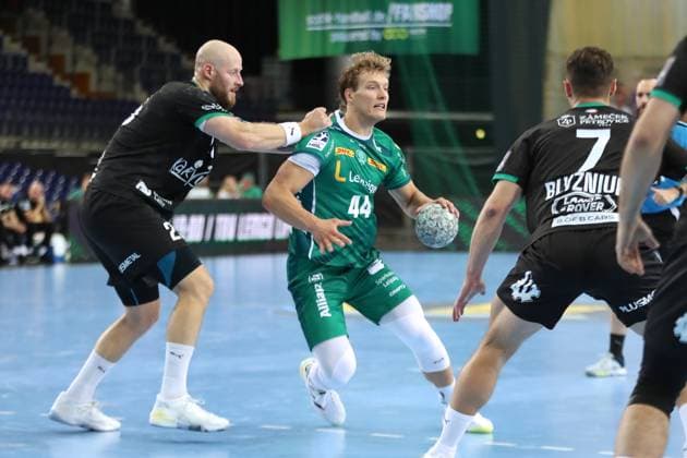 Handball test match SC DHfK Leipzig vs HC Banik Karvina, 23 08 25 Blaer Hinriksson 44, SC DHfK Leipzig is grabbed by Jan Uzek 23, Banik Karvina Handball, DAIKIN HBL, Season 2025 2026, Test match SC DHfK Leipzig vs HC Banik Karvina on 23 08 25 in the Quarterback Immobilien Arena Leipzig Copyright: xBEAUTIFULxSPORTS JanxKaeferx