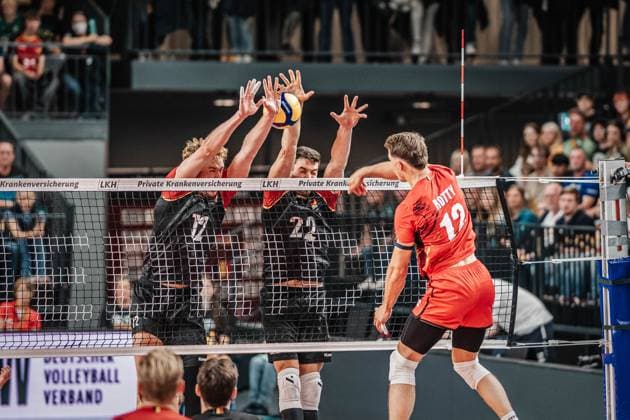 Volleyball mens international match Germany vs Belgium 23 08 2025 Seppe Rotty 12 Belgium against the block of Anton Brehme 12 Germany and Tobias Brand 22 Germany