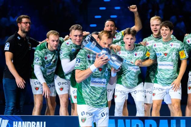 Munich HBL Super Cup 2025 Fuechse Berlin THW Kiel Max Darj Berlin kisses the cup Munich SAP Garden Bayern Germany