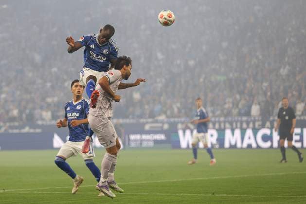 Christopher Antwi Adjei FC Schalke 04 and Gerrit Holtmann VfL Bochum in a duel during the 2 Bundesliga match between FC Schalke 04 and VfL Bochum, Veltins Arena on August 23, 2025 in Gelsenkirchen, Germany, Germany Photo by Oliver Kaelke DeFodi Images Christopher Antwi Adjei FC Schalke 04 and Gerrit Holtmann VfL Bochum battle for the ball during the 2 Bundesliga match between FC Schalke 04 and VfL Bochum at Veltins Arena on August 23, 2025 in Gelsenkirchen, Germany Photo by Oliver Kaelke DeFodi Images DFB DFL REGULATIONS PROHIBIT ANY USE OF PHOTOGRAPHS AS IMAGE SEQUENCES AND OR QUASI VIDEO Photo by Oliver Kaelke DeFodi Images