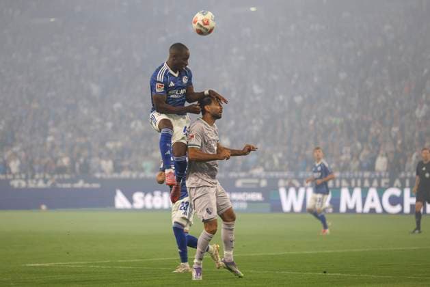 Christopher Antwi Adjei FC Schalke 04 and Gerrit Holtmann VfL Bochum in a duel during the 2 Bundesliga match between FC Schalke 04 and VfL Bochum, Veltins Arena on August 23, 2025 in Gelsenkirchen, Germany, Germany Photo by Oliver Kaelke DeFodi Images Christopher Antwi Adjei FC Schalke 04 and Gerrit Holtmann VfL Bochum battle for the ball during the 2 Bundesliga match between FC Schalke 04 and VfL Bochum at Veltins Arena on August 23, 2025 in Gelsenkirchen, Germany Photo by Oliver Kaelke DeFodi Images DFB DFL REGULATIONS PROHIBIT ANY USE OF PHOTOGRAPHS AS IMAGE SEQUENCES AND OR QUASI VIDEO Photo by Oliver Kaelke DeFodi Images