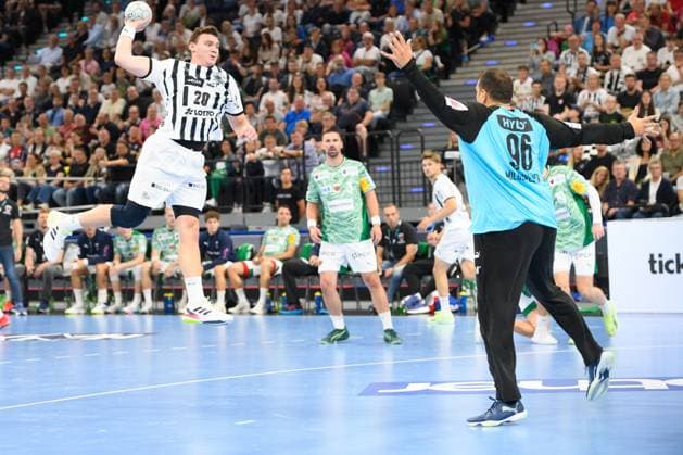 Lukas Laube (20 THW Kiel) and Goalkeeper Dejan Milosavljev (96 Füchse Berlin) during the DHB Supercup match between Füchse Berlin and THW Kiel, SAP Garden, Munich, Germany. (Sven Beyrich SPP) Copyright: xSvenxBeyrich SPPx spp-en-SvBe-SvBe-20250823-ND5_2302