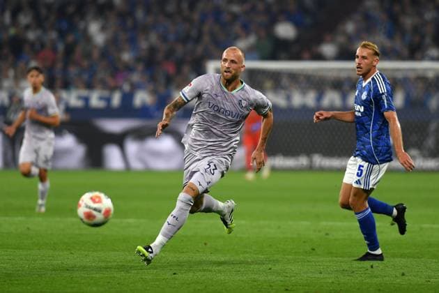 Philipp Hofmann VfL Bochum and Timo Becker FC Schalke 04 in a duel during the 2 Bundesliga match between FC Schalke 04 and VfL Bochum, Veltins Arena on August 23, 2025 in Gelsenkirchen, Germany, Germany Photo by Ralf Treese DeFodi Images Philipp Hofmann VfL Bochum and Timo Becker FC Schalke 04 battle for the ball during the 2 Bundesliga match between FC Schalke 04 and VfL Bochum at Veltins Arena on August 23, 2025 in Gelsenkirchen, Germany Photo by Ralf Treese DeFodi Images Photo by Ralf Treese DeFodi Images