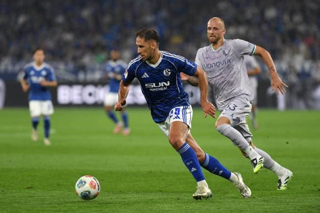 Nikola Katic FC Schalke 04 and Philipp Hofmann VfL Bochum in a duel during the 2 Bundesliga match between FC Schalke 04 and VfL Bochum, Veltins Arena on August 23, 2025 in Gelsenkirchen, Germany, Germany Photo by Ralf Treese DeFodi Images Nikola Katic FC Schalke 04 and Philipp Hofmann VfL Bochum battle for the ball during the 2 Bundesliga match between FC Schalke 04 and VfL Bochum at Veltins Arena on August 23, 2025 in Gelsenkirchen, Germany Photo by Ralf Treese DeFodi Images Photo by Ralf Treese DeFodi Images