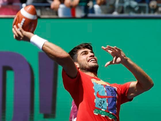 Carlos Alcaraz of Spain throws a football in Arthur Ashe Stadium on Arthur Ashe Kids Day at the 2025 US Open Tennis Championship at the USTA Billie Jean King National Tennis Center in New York City on Saturday, August 23, 2025 in New York City.  NYP20250823121 JOHNxANGELILLO