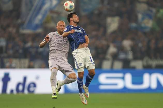 Philipp Hofmann VfL Bochum and Adrian Gantenbein FC Schalke 04 in a duel during the 2 Bundesliga match between FC Schalke 04 and VfL Bochum, Veltins Arena on August 23, 2025 in Gelsenkirchen, Germany, Germany Photo by Oliver Kaelke DeFodi Images Philipp Hofmann VfL Bochum and Adrian Gantenbein FC Schalke 04 battle for the ball during the 2 Bundesliga match between FC Schalke 04 and VfL Bochum at Veltins Arena on August 23, 2025 in Gelsenkirchen, Germany Photo by Oliver Kaelke DeFodi Images DFB DFL REGULATIONS PROHIBIT ANY USE OF PHOTOGRAPHS AS IMAGE SEQUENCES AND OR QUASI VIDEO Photo by Oliver Kaelke DeFodi Images