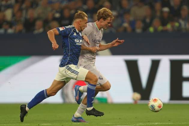 Timo Becker FC Schalke 04 and Mats Pannewig VfL Bochum in a duel during the 2 Bundesliga match between FC Schalke 04 and VfL Bochum, Veltins Arena on August 23, 2025 in Gelsenkirchen, Germany Photo by Oliver Kaelke DeFodi Images Timo Becker FC Schalke 04 and Mats Pannewig VfL Bochum battle for the ball during the 2 Bundesliga match between FC Schalke 04 and VfL Bochum at Veltins Arena on August 23, 2025 in Gelsenkirchen, Germany Photo by Oliver Kaelke DeFodi Images DFB DFL REGULATIONS PROHIBIT ANY USE OF PHOTOGRAPHS AS IMAGE SEQUENCES AND OR QUASI VIDEO Photo by Oliver Kaelke DeFodi Images