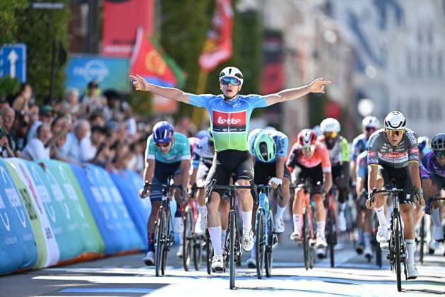Belgian Arnaud De Lie of Lotto Cycling Team (C) celebrates as he wins before Dutch Mathieu van der Poel of Alpecin-Deceuninck (R) the sprint at the finish of the fifth and last stage of the Renewi Tour multi-stage cycling race, 185km from and to Leuven on Sunday 24 August 2025. The five-day race takes place in Belgium and the Netherlands. DAVIDxPINTENS  x132182136x