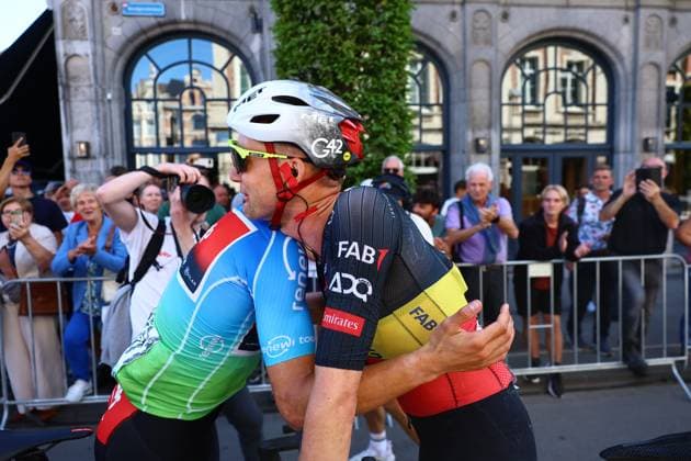 Belgian winner Arnaud De Lie of Lotto Cycling Team and Belgian Tim Wellens of UAE Team Emirates embrace after the fifth and last stage of the Renewi Tour multi-stage cycling race, 185km from and to Leuven on Sunday 24 August 2025. The five-day race takes place in Belgium and the Netherlands. DAVIDxPINTENS  x132182548x