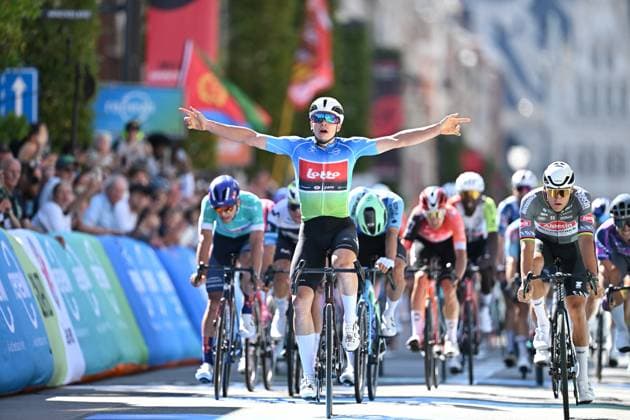 Belgian Arnaud De Lie of Lotto Cycling Team (C) celebrates as he wins before Dutch Mathieu van der Poel of Alpecin-Deceuninck (R) the sprint at the finish of the fifth and last stage of the Renewi Tour multi-stage cycling race, 185km from and to Leuven on Sunday 24 August 2025. The five-day race takes place in Belgium and the Netherlands. DAVIDxPINTENS  x132182869x