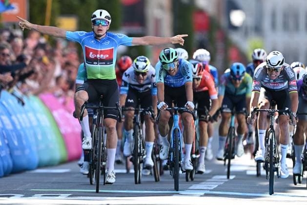 Belgian Arnaud De Lie of Lotto Cycling Team (L) celebrates as he wins before Dutch Mathieu van der Poel of Alpecin-Deceuninck (R) and Belgian Dries De Bondt of Decathlon AG2R La Mondiale Team (C) the sprint at the finish of the fifth and last stage of the Renewi Tour multi-stage cycling race, 185km from and to Leuven on Sunday 24 August 2025. The five-day race takes place in Belgium and the Netherlands. DAVIDxPINTENS  x132182888x