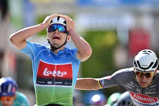Belgian Arnaud De Lie of Lotto Cycling Team (C) celebrates as he wins before Dutch Mathieu van der Poel of Alpecin-Deceuninck (R) the sprint at the finish of the fifth and last stage of the Renewi Tour multi-stage cycling race, 185km from and to Leuven on Sunday 24 August 2025. The five-day race takes place in Belgium and the Netherlands. DAVIDxPINTENS  x132182935x