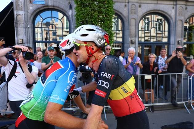 Belgian winner Arnaud De Lie of Lotto Cycling Team and Belgian Tim Wellens of UAE Team Emirates embrace after the fifth and last stage of the Renewi Tour multi-stage cycling race, 185km from and to Leuven on Sunday 24 August 2025. The five-day race takes place in Belgium and the Netherlands. DAVIDxPINTENS  x132183181x