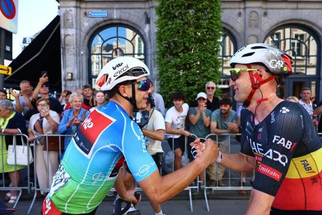 Belgian winner Arnaud De Lie of Lotto Cycling Team and Belgian Tim Wellens of UAE Team Emirates shake hands after the fifth and last stage of the Renewi Tour multi-stage cycling race, 185km from and to Leuven on Sunday 24 August 2025. The five-day race takes place in Belgium and the Netherlands. DAVIDxPINTENS  x132183601x