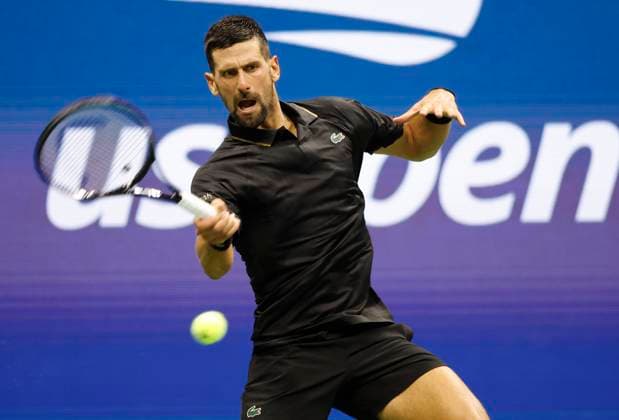 Novak Djokovic of Serbia returns the ball to Learner Tien in a Men s Singles first round match at the 2025 US Open Tennis Championship at the USTA Billie Jean King National Tennis Center in New York City on Sunday, August 24, 2025.  NYP20250824836 JOHNxANGELILLO