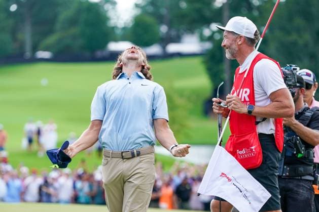 August 24, 2025, Atlanta, Georgia, USA: Tommy Fleetwood (ENG) (L) and his caddie Ian Finnis, celebrate on the 18th green after winning the 2025 TOUR Championship at East Lake Golf Club. Atlanta USA - ZUMAw109 20250824_fap_w109_033 Copyright: xDebbyxWongx
