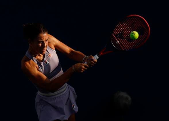 Emma Navarro returns a ball to Yafan Wang of China in the first set of their first round match on the grandstand court at the 2025 US Open Tennis Championship at the USTA Billie Jean King National Tennis Center in New York City on Sunday, August 24, 2025.  NYP20250824902 JOHNxANGELILLO