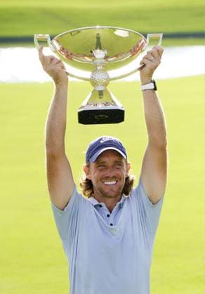 Golf: TOUR Championship Britain s Tommy Fleetwood poses with the victor s trophy after winning the TOUR Championship golf tournament at East Lake Golf Club in Atlanta, Georgia, on Aug. 24, 2025.  A14AA0004783238P