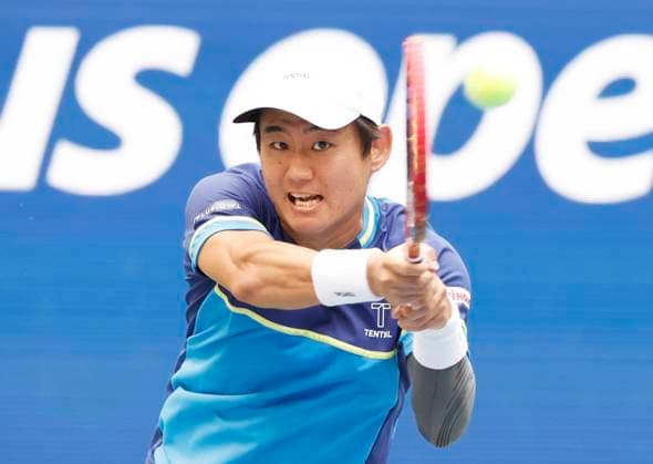 Yoshihito Nishioka of Japan returns a ball in the 3rd set to Frances Tiafoe before losing in his first round match in Arthur Ashe Stadium at the 2025 US Open Tennis Championship at the USTA Billie Jean King National Tennis Center in New York City on Monday, August 25, 2025.  NYP20250825104 JOHNxANGELILLO