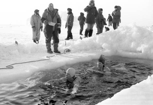 Krasnoyarsk Region, Russia. Members of the expedition representing the International Association for Winter Marathon Swimming take part in a swim in an ice hole in the Kara Sea near Golomyanny Island of the Severnaya Zemlya archipelago in Taymyr (Dolgan-Nenets) Autonomous District. As part of the UNESCO-sponsored From Pole to Pole global expedition, they become the first in the world to complete a mass high-latitude swim with record-breaking duration in Arctic ice water at minus 1.8Ã‚Â°C, while the air temperature is minus 20Ã‚Â°C. Scientists and medical professionals obtain new data on human adaptation to cold and recovery after exposure to extreme cold. Oleg Buldakov TASS  83413547