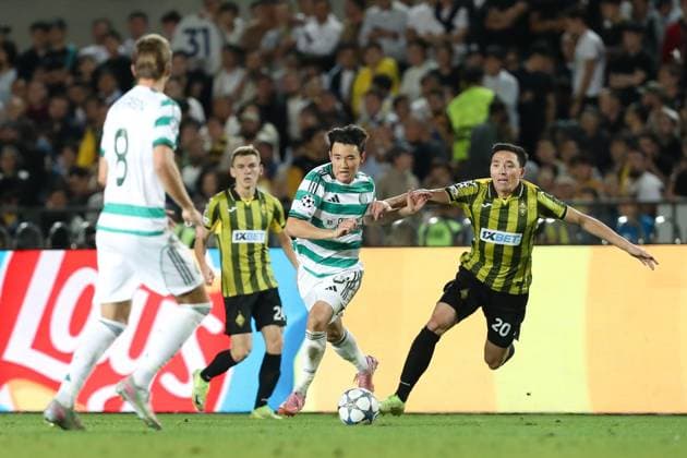 Yang Hyun-Jun of Celtic and Yerkin Tapalov of Kairat Almaty Kairat Almaty v Celtic, UEFA Champions League, Play-Off Round, Second Leg, Football, Almaty Central Stadium, Almaty, Kazakhstan - 26 Aug 2025Almaty Almaty Central Stadium Kazakhstan EDITORIAL USE ONLY No use with unauthorised audio, video, data, fixture lists, club league logos or live services. Online in-match use limited to 120 images, no video emulation. No use in betting, games or single club league player publications. Copyright: xNikitaxBassov Shutterstockx 15455823bi