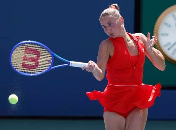 Marta Kostyuk of Ukraine returns a ball to Katie.Boulter of United Kingdom in the second set of their first round match in the Grandstand court on day 3 at the 2025 US Open Tennis Championship at the USTA Billie Jean King National Tennis Center in New York City on Tuesday, August 26, 2025. Kostyuk defeated Boulter in straight sets.  NYP20250826108 JOHNxANGELILLO