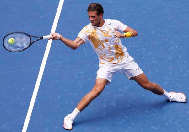 Vit Kopriva of Czechia returns a ball to Jannik Sinner of Italy in the first set of their first round match in Arthur Ashe Stadium on day 3 at the 2025 US Open Tennis Championship at the USTA Billie Jean King National Tennis Center in New York City on Tuesday, August 26, 2025.  NYP20250826126 JOHNxANGELILLO