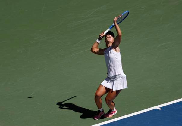 Iga Swiatek of Poland serves to Emiliana Arango of Colombia in their first round match in Arthur Ashe Stadium on day 3 at the 2025 US Open Tennis Championship at the USTA Billie Jean King National Tennis Center in New York City on Tuesday, August 26, 2025. Swiatek defeated Arango in straight sets.  NYP20250826103 JOHNxANGELILLO