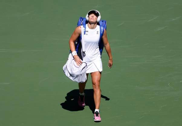 Iga Swiatek of Poland steps out on the court after she is introduced before playing Emiliana Arango of Colombia in a first round match in Arthur Ashe Stadium on day 3 at the 2025 US Open Tennis Championship at the USTA Billie Jean King National Tennis Center in New York City on Tuesday, August 26, 2025. Swiatek defeated Arango in straight sets.  NYP20250826105 JOHNxANGELILLO