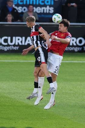 Harry Maguire of Manchester United, ManU and Cameron Gardner of Grimsby Town Grimsby Town v Manchester United, EFL Carabao Cup, Second Round, Football, Blundell Park, Grimsby, UK - 27 Aug 2025Grimsby Blundell Park United Kingdom EDITORIAL USE ONLY No use with unauthorised audio, video, data, fixture lists, club league logos or live services. Online in-match use limited to 120 images, no video emulation. No use in betting, games or single club league player publications.  Copyright: xPaulxCurrie Shutterstockx 15457582am