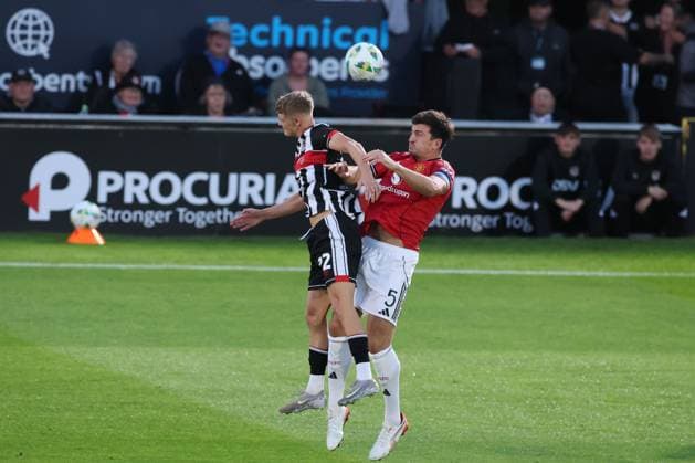 Harry Maguire of Manchester United, ManU and Cameron Gardner of Grimsby Town Grimsby Town v Manchester United, EFL Carabao Cup, Second Round, Football, Blundell Park, Grimsby, UK - 27 Aug 2025Grimsby Blundell Park United Kingdom EDITORIAL USE ONLY No use with unauthorised audio, video, data, fixture lists, club league logos or live services. Online in-match use limited to 120 images, no video emulation. No use in betting, games or single club league player publications.  Copyright: xPaulxCurrie Shutterstockx 15457582an