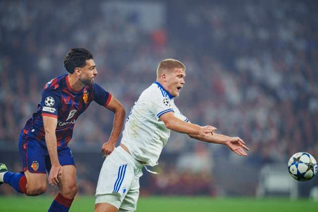 Champions League qualifier FC Copenhagen FC Basel 1893 Andreas Cornelius, FC Copenhagen and FC Basel s Nicolas Vouilloz vies for the ball during the Champions League qualifying match between FC Copenhagen and FC Basel 1893 at Parken in Copenhagen on Wednesday, August 27, 2025 , Copenhagen Denmark  Copyright: Ritzau Scanpix LiselottexSabroex spdk20250827-215852-L
