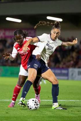Viv Lia of Arsenal Women competes with Seraina Piubel of West Ham United Women for the ball during the Pre-season Friendly match between Arsenal Women and West Ham United Women at Meadow Park, Borehamwood, England on 27 August 2025. Copyright: xJoshuaxSmithx 43810029