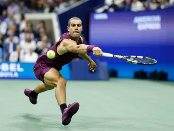 Carlos Alcaraz of Spain returns a ball in the third set before defeating Mattia Bellucci of Italy in straight sets in the second round in Arthur Ashe Stadium on day 4 at the 2025 US Open Tennis Championship at the USTA Billie Jean King National Tennis Center in New York City on Wednesday, August 27, 2025.  NYP20250827151 JOHNxANGELILLO