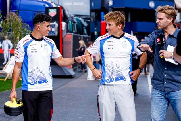 Isack Hadjar of France and Racing Bulls and Liam Lawson of New Zealand and Racing Bulls and Viaplay presenter Chiel van Koldenhoven of the Netherlands prior to the start of the Formula 1 Heineken Dutch Grand Prix 2025 at Circuit Zandvoort on August 28, 2025 in Zandvoort, Netherlands Photo by Marcel ter Bals DeFodi Images