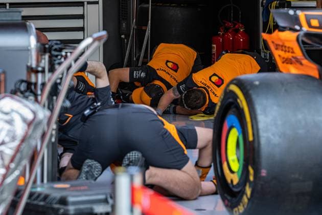28th August 2025; Circuit Zandvoort, Zandvoort, North Holland, Netherlands; Formula 1 Heineken Dutch Grand Prix 2024; Arrival Day; The McLaren F1 Team mechanics look like they are looking for a dropped nut but are doing team stretching exercises  GodfreyxPitt