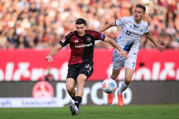 Soccer, 2 Bundesliga, 20250829, 1 FC Nürnberg SC Paderborn In the picture from l Luka LOCHOSHVILI Nürnberg, 24 , Filip BILBIJA Paderborn, 7 Zweikampf Ball Nürnberg Max Morlock Stadion Bayern Germany Copyright: Passion2Press MarkusxFischerx