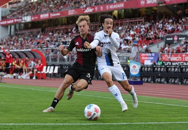 29 08 2025 Soccer Season 2025 2026 2 Soccer Bundesliga 04 Matchday 1 FC Nürnberg FCN Club SC Paderborn 07 SCP Sportfoto Zink DaMa xdaxmax DFL regulations prohibit any use of photographs as image sequences and or quasi video only for editorial use Tim Janisch 32, 1 FC Nürnberg FCN Mika Baur 14, SC Paderborn 07