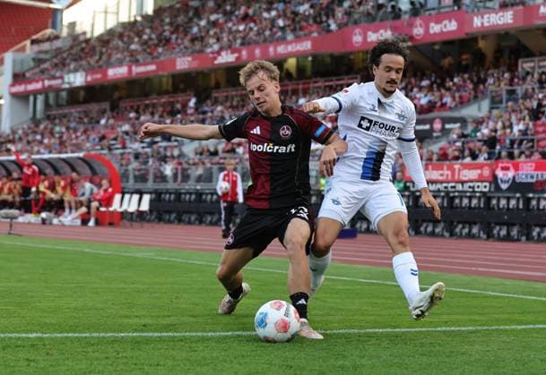29 08 2025 Soccer Season 2025 2026 2 Soccer Bundesliga 04 Matchday 1 FC Nürnberg FCN Club SC Paderborn 07 SCP Sportfoto Zink DaMa xdaxmax DFL regulations prohibit any use of photographs as image sequences and or quasi video only for editorial use Tim Janisch 32, 1 FC Nürnberg FCN Mika Baur 14, SC Paderborn 07