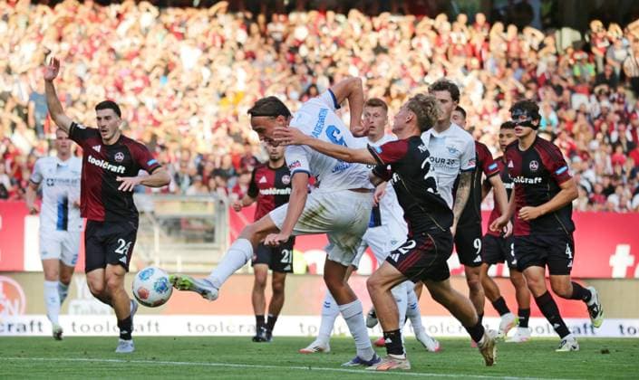 29 08 2025, xmohx, Fußball 2 Bundesliga, 1 FC Nuernberg SC Paderborn 07 v l Tim Janisch Nürnberg fouls Luis Engelns Paderborn , thereupon referee Michael Bacher shows him the red card, Janisch shows afterwards disappointed and the red card is taken back by the VAR DFL DFB REGULATIONS PROHIBIT ANY USE OF PHOTOGRAPHS as IMAGE SEQUENCES and or QUASI VIDEO Nuernberg