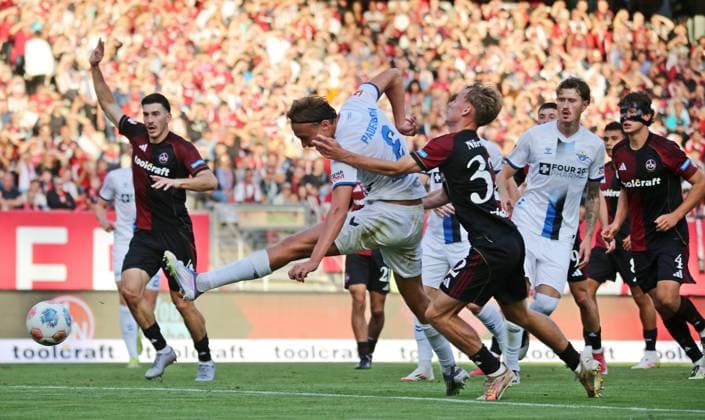29 08 2025, xmohx, Fußball 2 Bundesliga, 1 FC Nuernberg SC Paderborn 07 v l Tim Janisch Nürnberg fouls Luis Engelns Paderborn , thereupon referee Michael Bacher shows him the red card, Janisch shows afterwards disappointed and the red card is taken back by the VAR DFL DFB REGULATIONS PROHIBIT ANY USE OF PHOTOGRAPHS as IMAGE SEQUENCES and or QUASI VIDEO Nuernberg