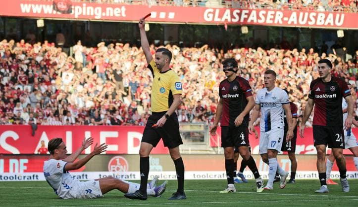 29 08 2025, xmohx, Fußball 2 Bundesliga, 1 FC Nuernberg SC Paderborn 07 v l Tim Janisch Nürnberg fouls Luis Engelns Paderborn , thereupon referee Michael Bacher shows him the red card, Janisch shows afterwards disappointed and the red card is taken back by the VAR DFL DFB REGULATIONS PROHIBIT ANY USE OF PHOTOGRAPHS as IMAGE SEQUENCES and or QUASI VIDEO Nuernberg