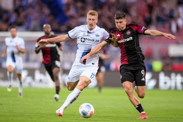 Soccer, 2 Bundesliga, 20250829, 1 FC Nürnberg SC Paderborn In the picture from l Laurin CURDA Paderborn, 17 , Semir TELALOVIC Nürnberg, 9 Zweikampf Ball Nürnberg Max Morlock Stadion Bayern Germany Copyright: Passion2Press MarkusxFischerx