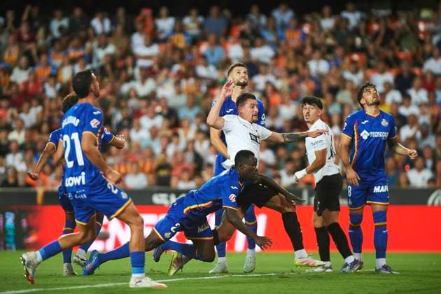 Baptiste Santamaria Valencia CF and Djene Nekounam Getafe CF during the LaLiga EA Sports match between Valencia CF and Getafe CF at Estadio de Mestalla on August 29, 2025 in Valencia, Spain Photo by Maria Jose Segovia DeFodi Images
