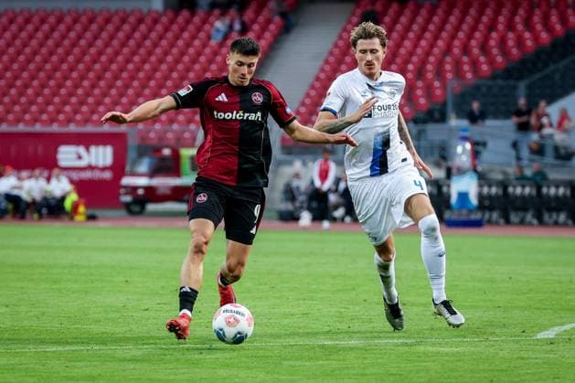 left to right Semir Telalovic 9 1FC Nuernberg in action with Calvin Brackelmann 4 SC Paderborn 07 , 1 FC Nuernberg vs SC Paderborn 07, DFL, 2 Bundesliga, Saison 2025 2026, Max Morlock Stadion, 4 Spieltag, Hinrunde, 29 08 2025 DFB regulations prohibit any use of photographs as image sequences and or quasi video Nuernberg Bayern Germany Copyright: xkolbert-press MartinxAgüerax