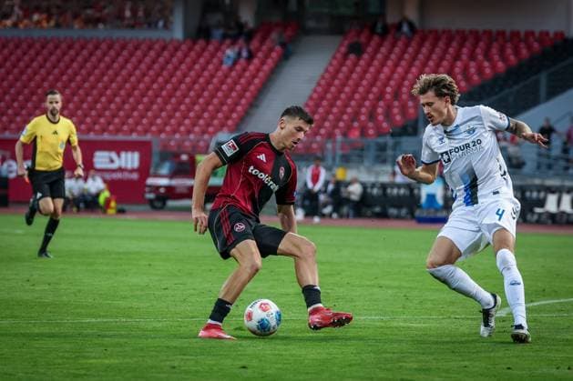 left to right Referee Michael Bacher watches the action between Semir Telalovic 9 1FC Nuernberg and Calvin Brackelmann 4 SC Paderborn 07, 1 FC Nuernberg vs SC Paderborn 07, DFL, 2 Bundesliga, Saison 2025 2026, Max Morlock Stadion, 4 Spieltag, Hinrunde, 29 08 2025 DFB regulations prohibit any use of photographs as image sequences and or quasi video Nuernberg Bayern Germany Copyright: xkolbert-press MartinxAgüerax