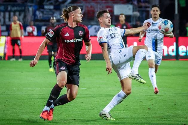 left to right Artem Stepanov 11 1FC Nuernberg in duel with Marcel Hoffmeier 33 SC Paderborn 07 , 1 FC Nuernberg vs SC Paderborn 07, DFL, 2 Bundesliga, Saison 2025 2026, Max Morlock Stadion, 4 Spieltag, Hinrunde, 29 08 2025 DFB regulations prohibit any use of photographs as image sequences and or quasi video Nuernberg Bayern Germany Copyright: xkolbert-press MartinxAgüerax
